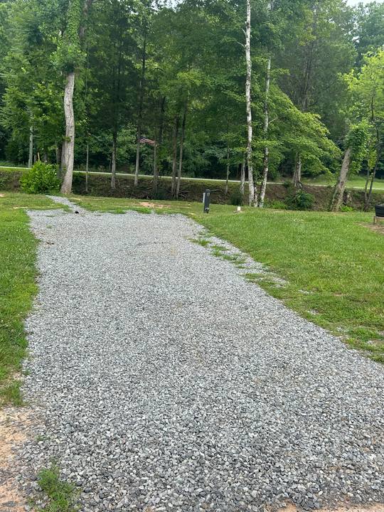 A gravel pad running back into the trees