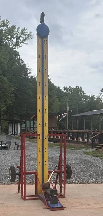 A tall carnival high-striker game
